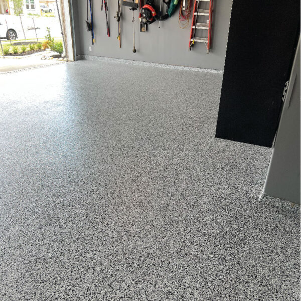 Floor Shield application in a basement by Dry Otter Waterproofing, highlighting durability and aesthetic appeal.