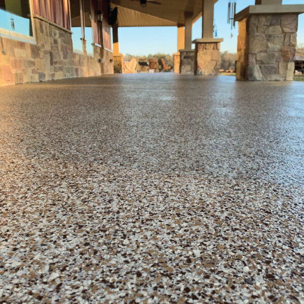 Completed Floor Shield project showcasing durable, aesthetically pleasing flooring in a basement by Dry Otter Waterproofing.