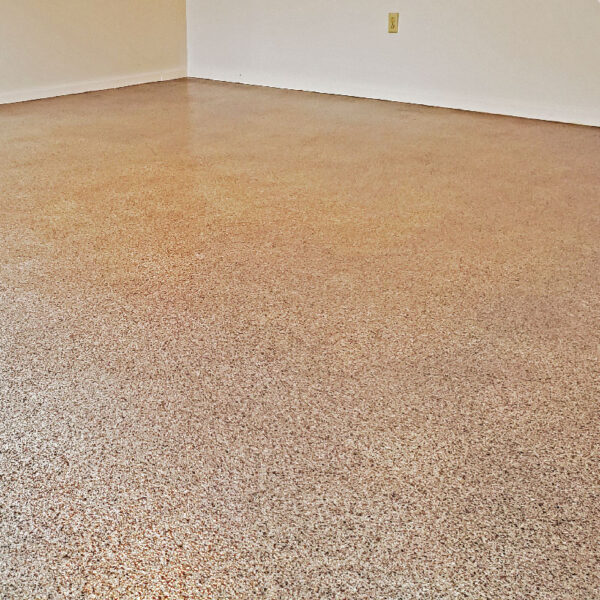 Floor Shield project displaying durable waterproof flooring in a stylish basement by Dry Otter Basement Waterproofing.