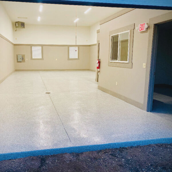 Floor Shield application in a basement showcasing durability and aesthetic appeal by Dry Otter Waterproofing.