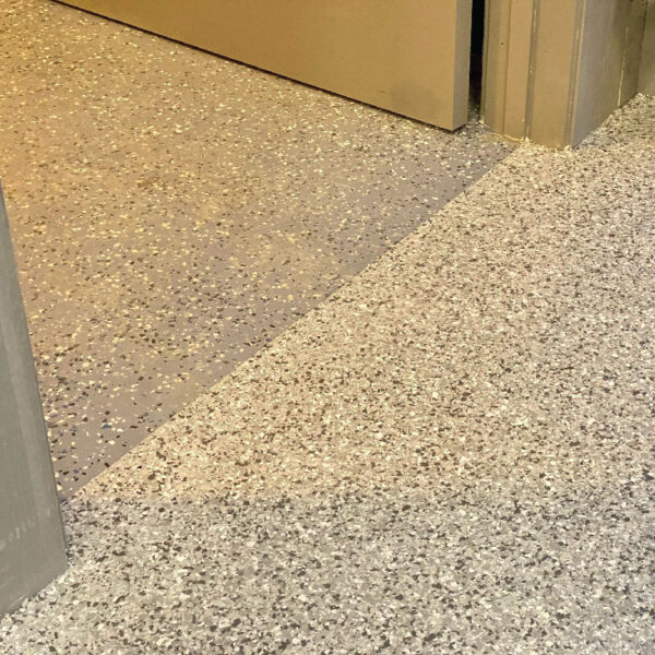 Floor Shield installation in a stylish basement by Dry Otter Waterproofing, demonstrating durability and design.