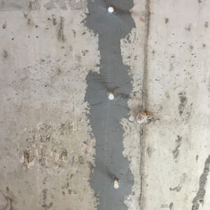 Residential foundation repair by Dry Otter, featuring epoxy injections and carbon fiber reinforcement.