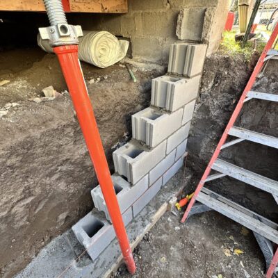 Foundation repair work by Dry Otter Basement Waterproofing, showcasing epoxy injection technique in a residential property.